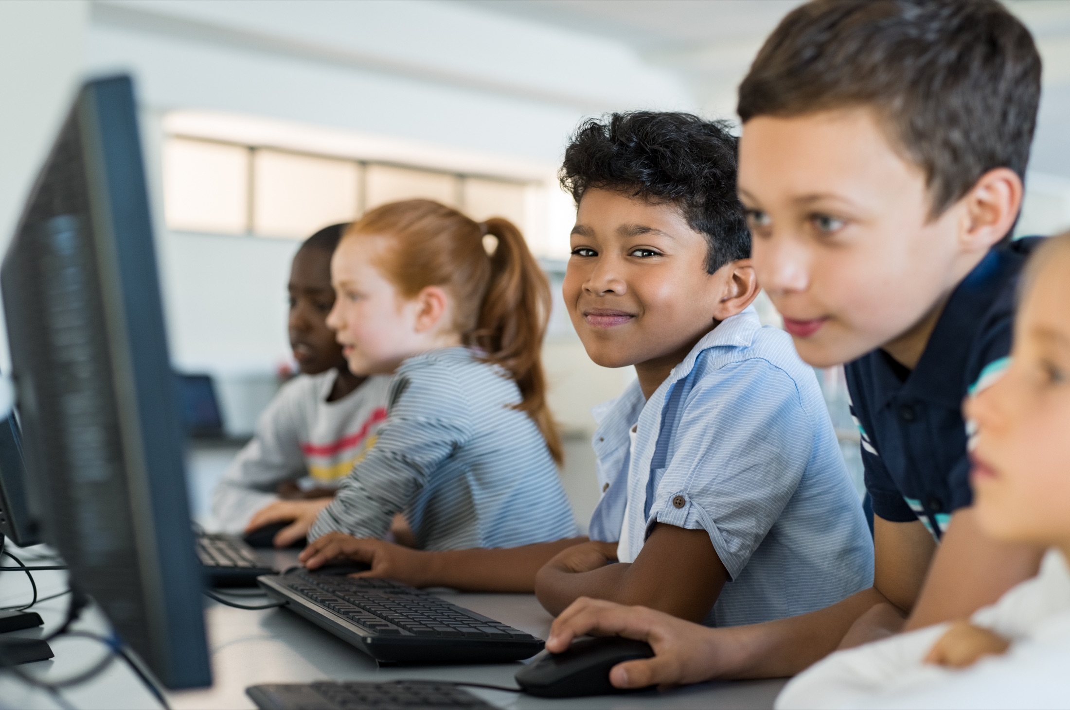 Students using computers in a classroom
